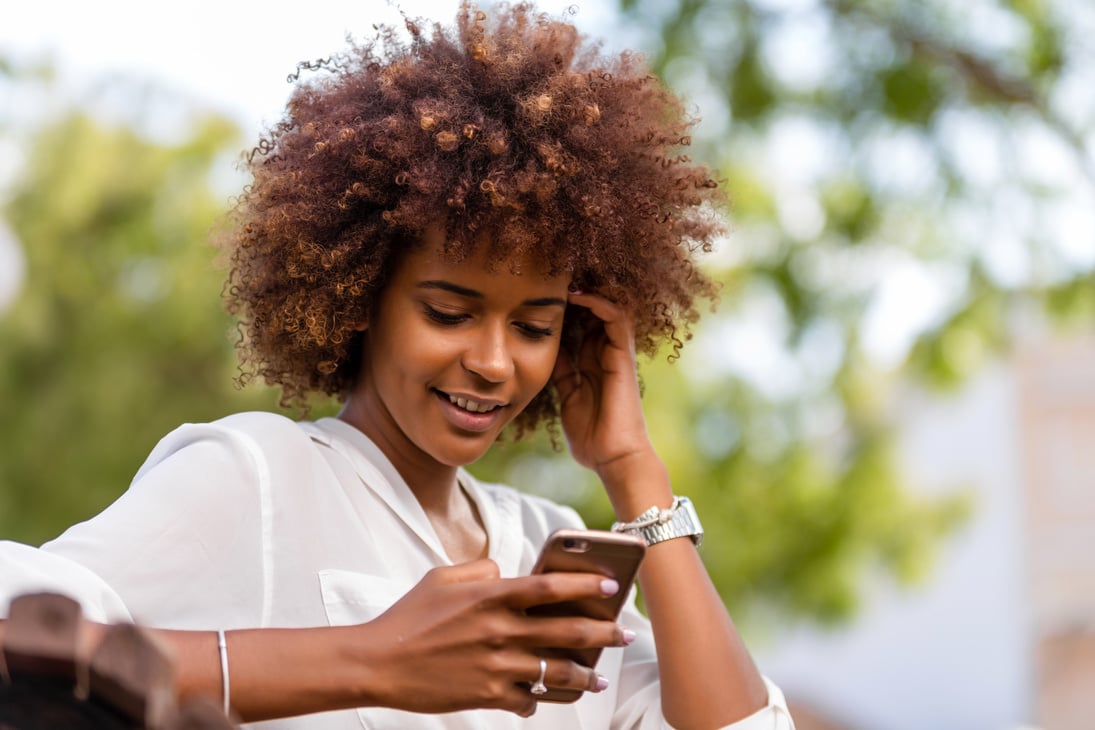 Happy Woman using Smartphone 